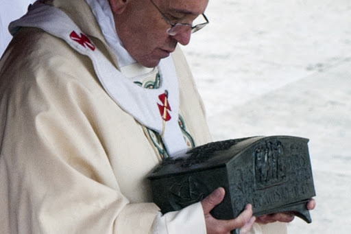 Pope Francis holds an urn &#8211; it
