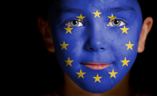 Portrait of a child with a painted EU flag, closeup &#8211; it