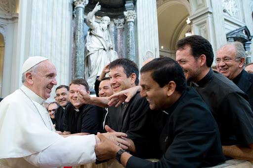 Pope Francis greets the priests during a meeting with the clergy of Rome