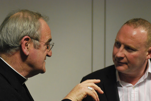 A man talking with a priest &#8211; it