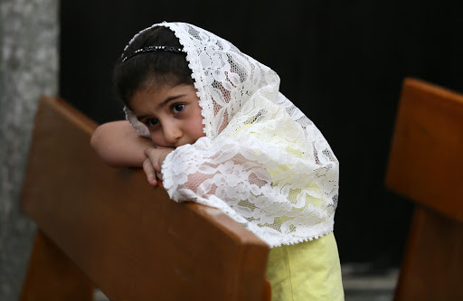 Christian child prays in Church in Iraq &#8211; it