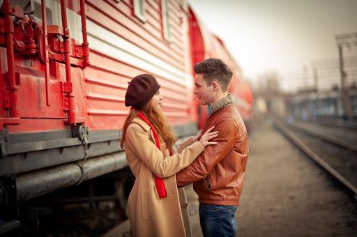 young couple in love near the red train &#8211; it