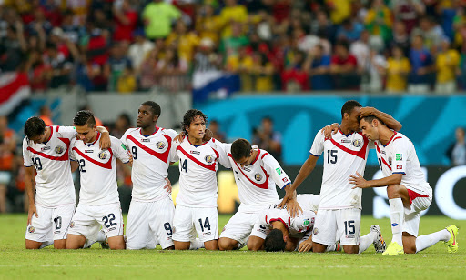 The Costa Rica soccer team praying during a match