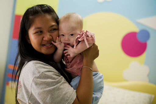 THAILAND, Siriracha : Thai surrogate mother Pattaramon Chanbua (L) holds her baby Gammy &#8211; it