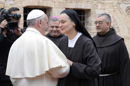 Pope Francis speaks with a nun &#8211; AFP