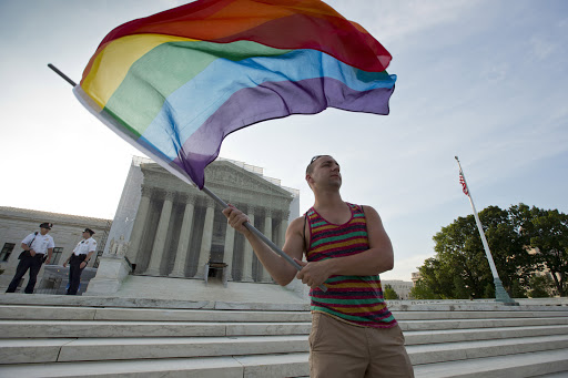 Gay rights advocate waves rainbow flag in front of US Supreme Court &#8211; it