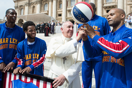 Pope Francis posing with members of the Harlem Globe Trotters basketball team &#8211; AFP