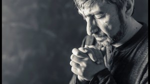 Man Closed His Eyes To Pray © Anelina / Shutterstock