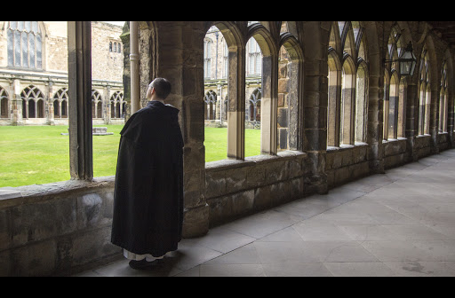 Dominican monk in cloister &#8211; it