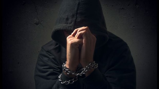 Hands in chains. Arrested man, prisoner, hostage, hopeless and powerless, drug addict, crime concept