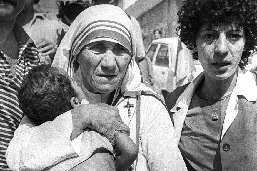 Peace Nobel Prize Mother Teresa hugs a child in West Beirut 14 August 1982. Mother Teresa visited the children who were in the Islamic Home which was shelled during the Israeli attacks on West Beirut. The children are now being evacuated to the mountains after living for several days without food and water. Mother Teresa will be beatified, 19 October 2003, in a ceremony in St Peter's Square, Vatican. The beatification ceremony is the penultimate step to being canonised a saint and has been the shortest in modern history. Following the beatification, a second miracle has to be verified by the Vatican before Mother Teresa can be proclaimed a saint. AFP PHOTO DOMINIQUE FAGET / AFP / DOMINIQUE FAGET