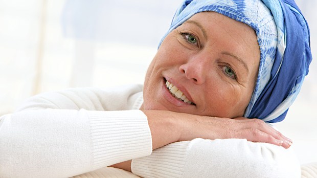 Portrait of a nice middle-aged woman recovering after chemotherapy &#8211; focus on her smiling relax attitude &#8211; shutterstock_163011854
