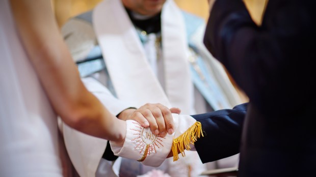 web-catholic-wedding-ihs-hands-mn-studio-shutterstock_333224522