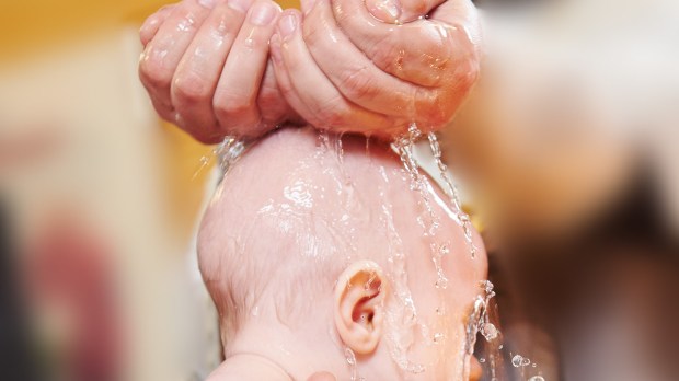web-holy-water-baptism-hands-baby-shutterstock_389438011-dmitry-kalinovsky-ai
