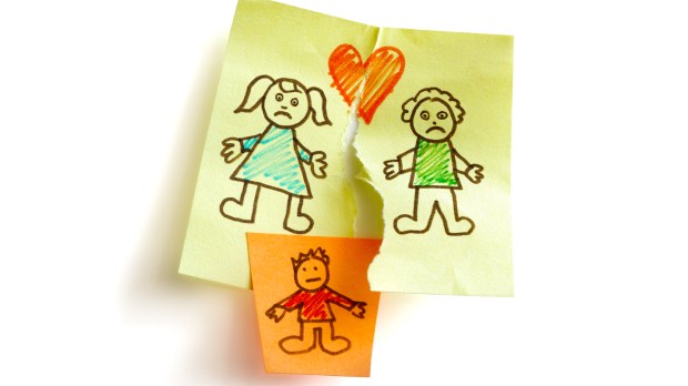 Unhappy family and child custody battle concept sketched on sticky note paper
