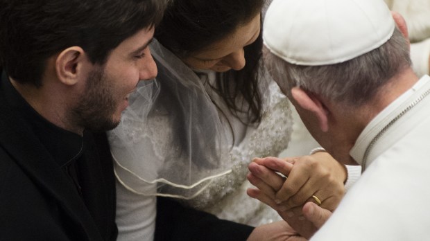 Pope Francis greets newly married couple – newlywed couple