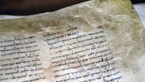QUMRAN, ISRAEL – SEP 27 2008:The Dead Sea Scrolls on display at the caves of Qumran.They are a collection of 972 Hebrew Bible texts discovered between 1946-1956 at Khirbet Qumran, Israel.
