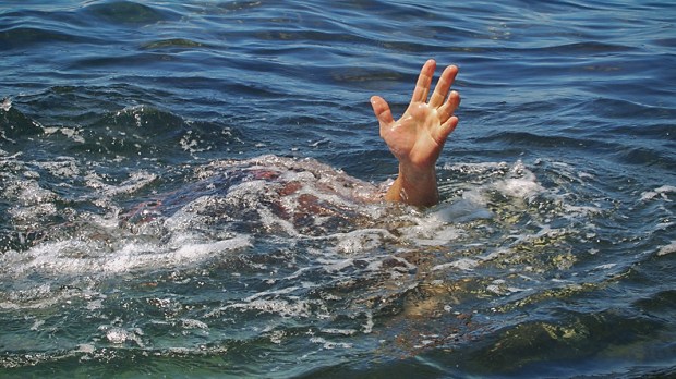 HERO-HAND-REACHING-DROWNING-Russal-Shutterstock_91374980