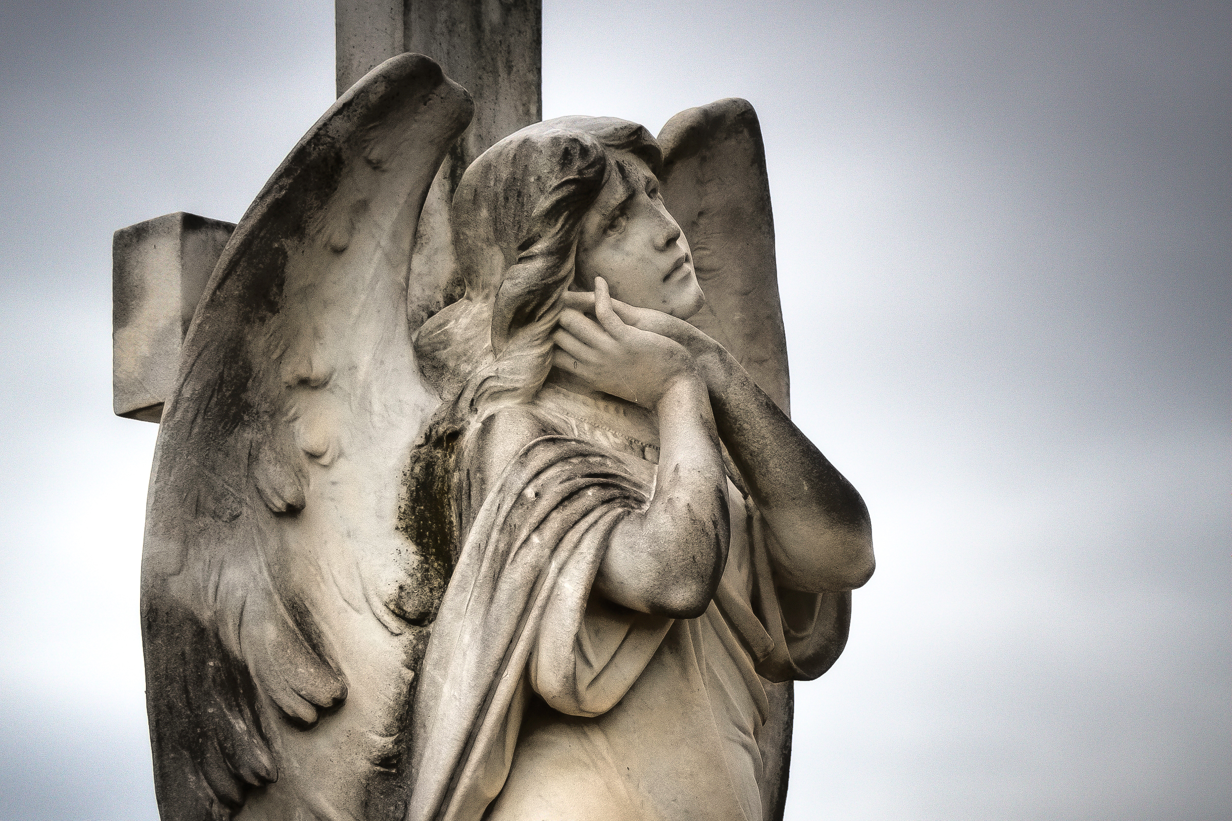 WEB-ANGEL-STATUE-CROSS-CLOUDS–Neale-Cousland-Shutterstock_81230815