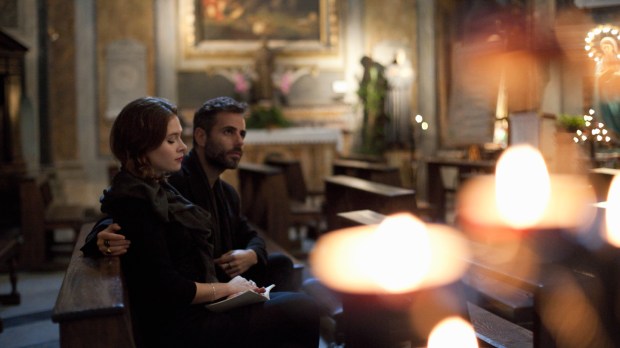 couple visiting church, Rome, Italy