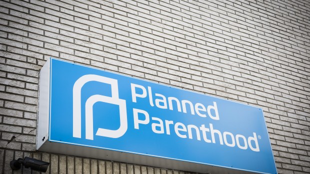 WEB-PLANNED-PARENTHOOD-SIGN-BRICK-Glynnis-Jones-Shutterstock_411409570