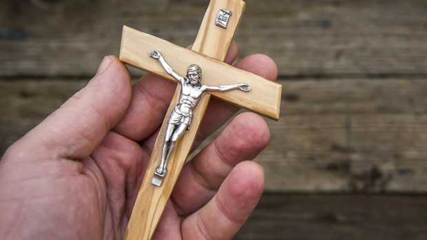 WEB3-HAND-CROSS-CRUCIFIX-WOOD-Oleg-Golovnev-Shutterstock_485229292