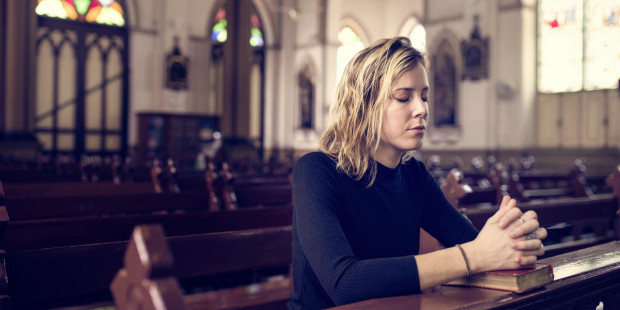 web3-woman-praying-church-mass-bible-shutterstock