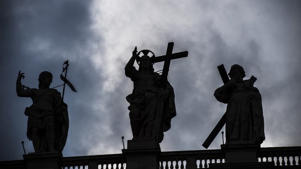 Statue of Jesus on the top of Saint Peter Basilica facade