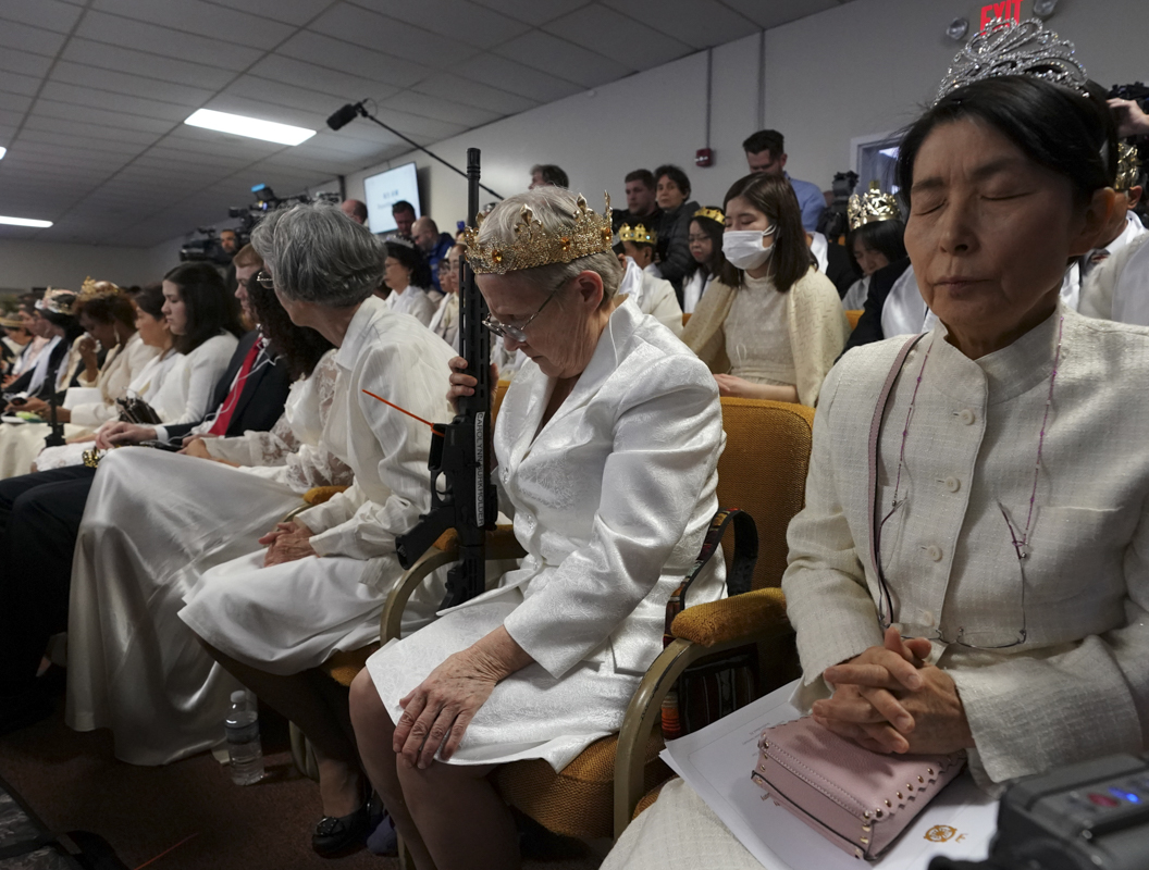 WORSHIPPERS AT WORLD PEACE AND UNIFICATION SANCTUARY HOLD WEAPONS