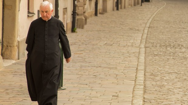 PRIEST WALKING