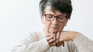 web3-woman-elder-grandma-pray-rosary-shutterstock_786236110.jpg