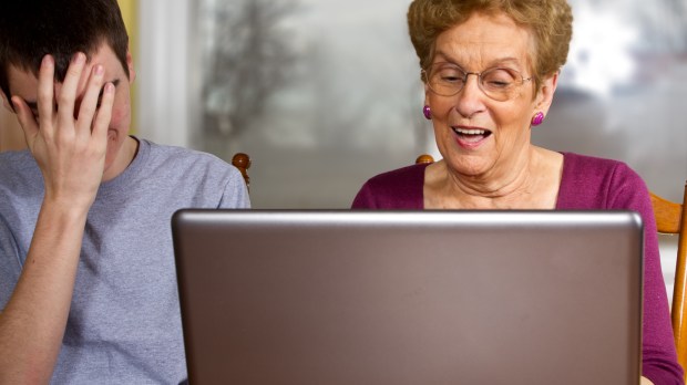 web2-teen-boy-frustrated-trying-to-teach-grandmother-to-use-a-laptop-shutterstock_95580892.jpg