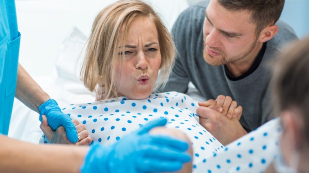 woman in labor with husband