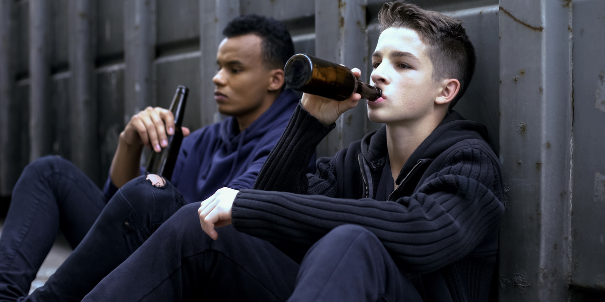 teenager guys drinking beer