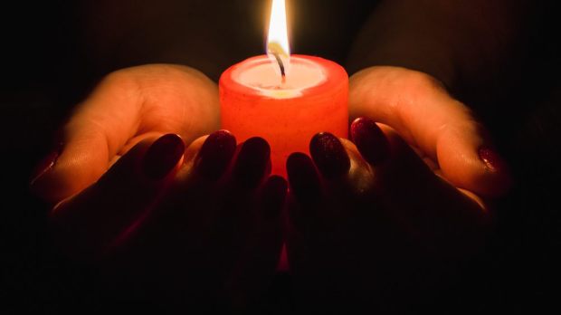 web-christmas-candles-pray-mourn-shutterstock_1576801633-tashulia.jpg