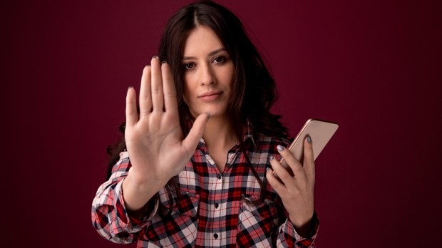 web3-girl-or-young-woman-holding-mobile-phone-as-internet-stalked-victim-abused-in-cyberbullying-or-cyber-bullying-stress-concept-and-in-smartphone-and-network-addiction-shutterstock_132.jpg