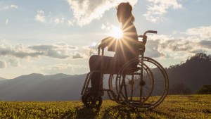WEB3-Disabled-handicapped-woman-is-sitting-on-wheelchair-at-sunset-Shutterstock_1562699614.jpg