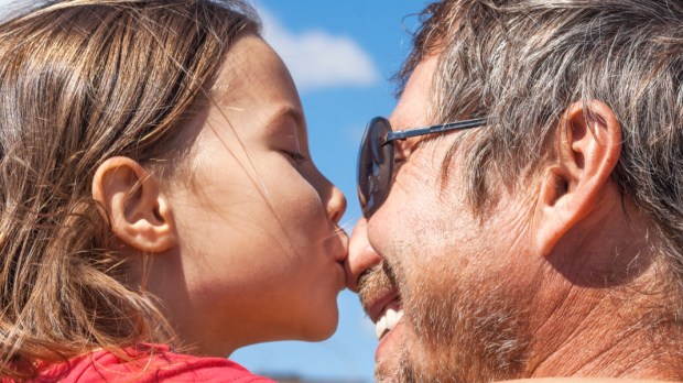 WEB3-Little-girl-kisses-her-dad-in-the-nose-Shutterstock_1028374978.jpg