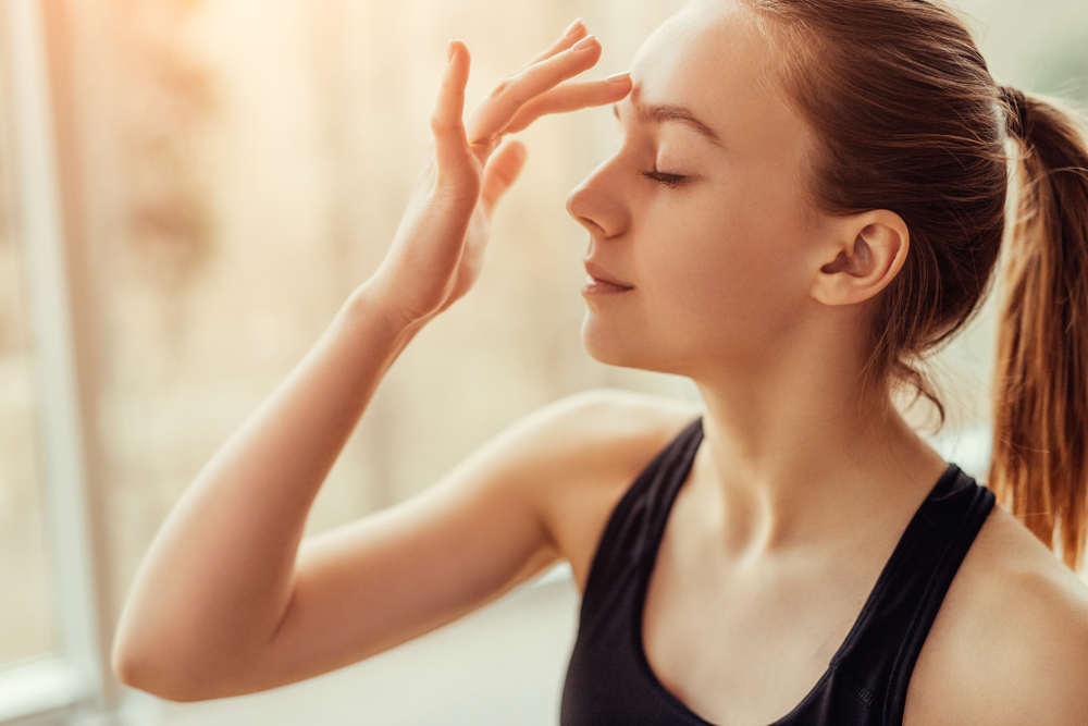 girl making sign of a cross