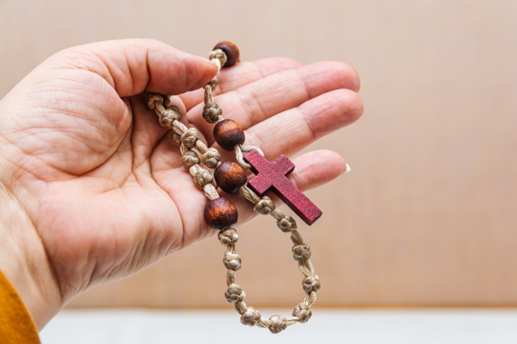 Rosary in hand