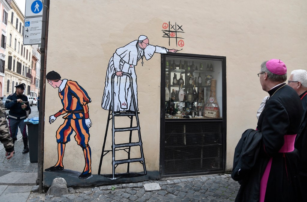 street-art-collage-by-Italian-artist-Maupal-showing-Pope-Francis-AFP