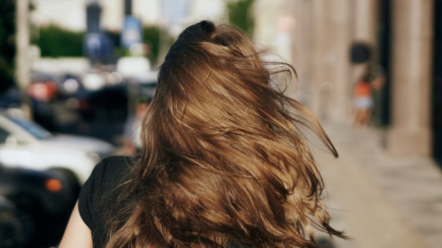 BACK-WOMAN-STREET-shutterstock_688000768-1